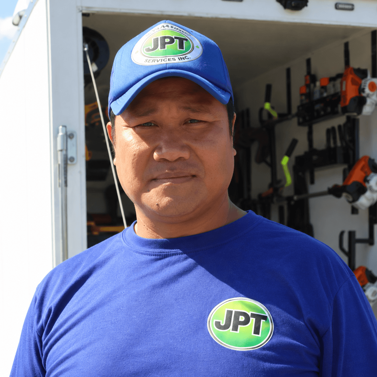 Jacson wearing his JPT Landscaping uniform